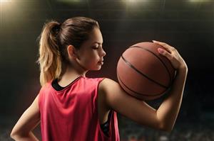 Teen Girl Holding A Basketball